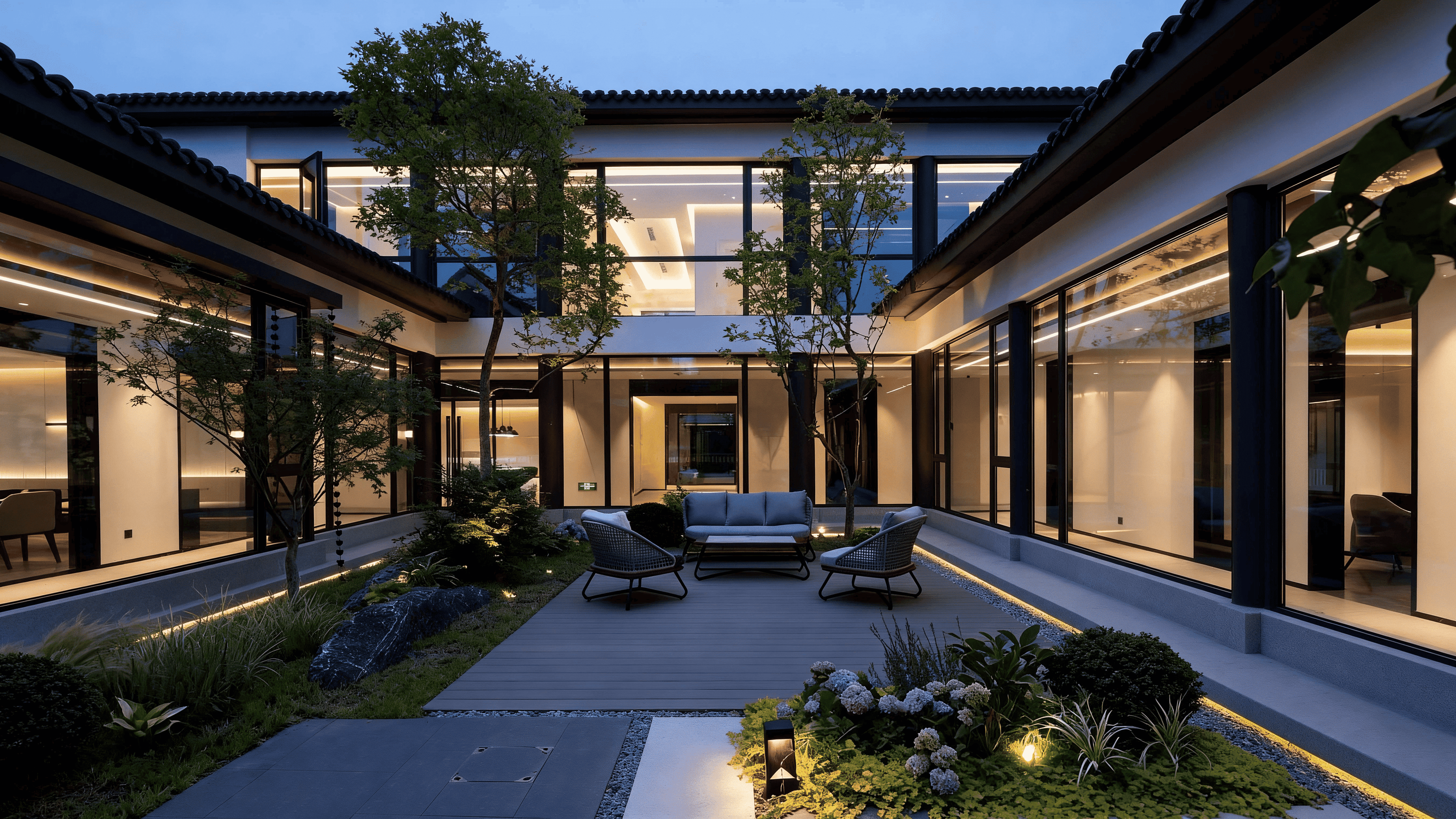 A traditional Chinese courtyard under soft moonlight, still water reflecting a dark indigo sky